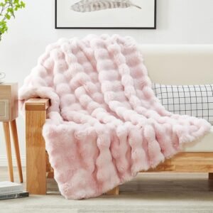 faux rabbit fur throw blanket in multiple colors on couch