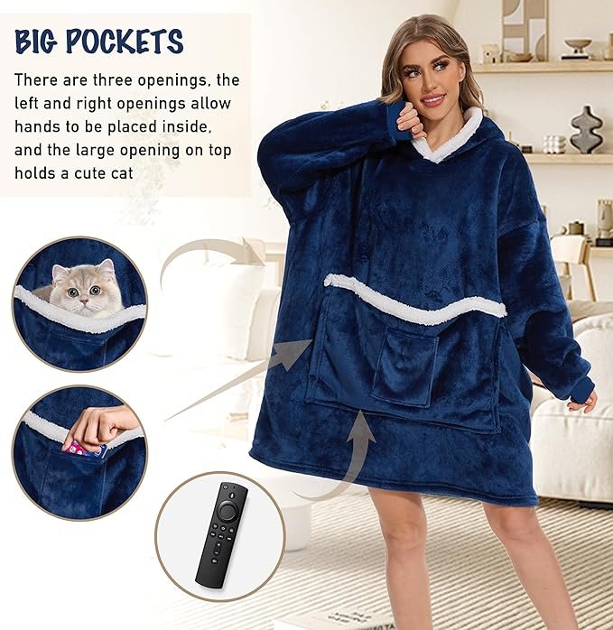 Woman wearing wearable blanket hoodie with cat snuggled in front pocket