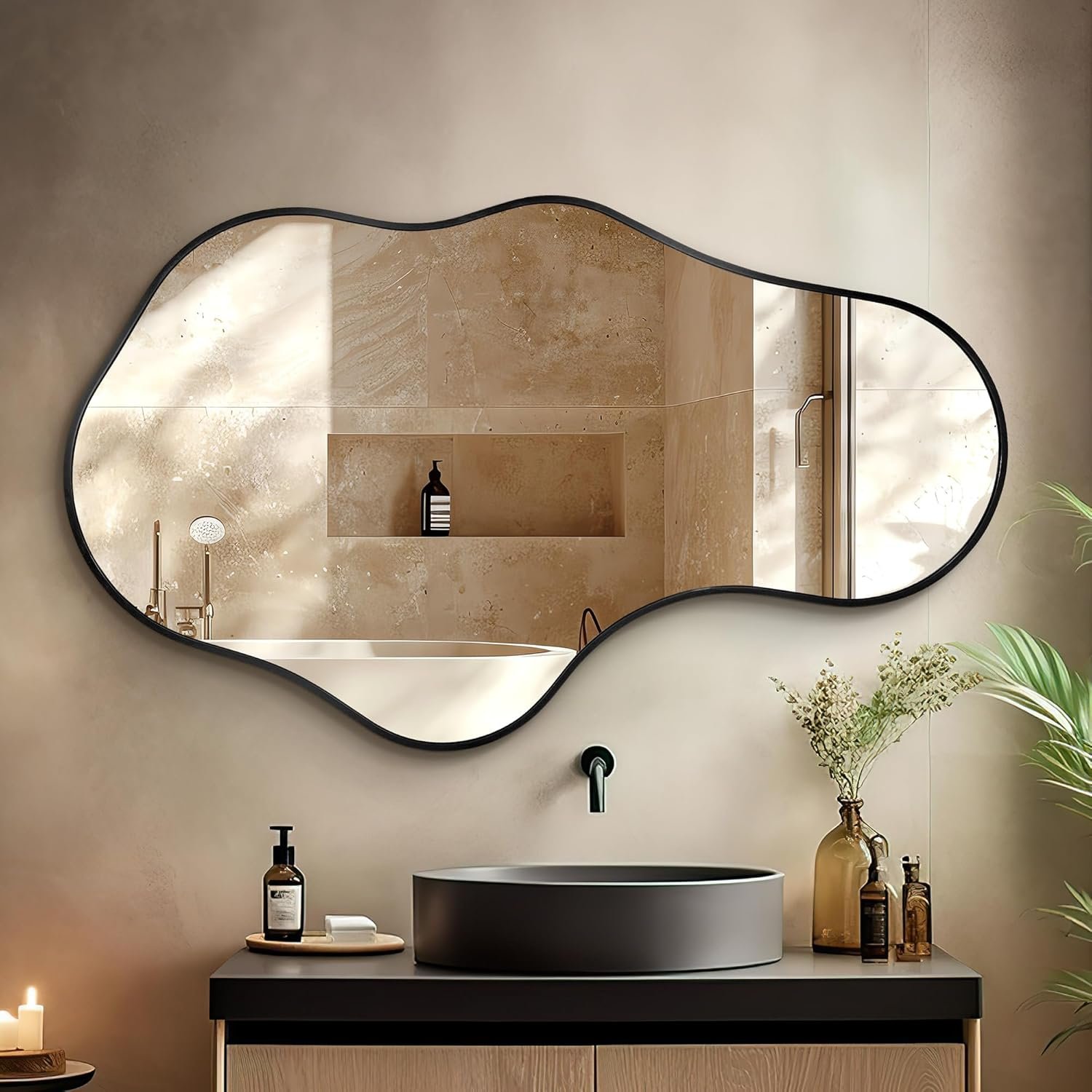 irregular asymmetrical wall mirror above a modern bathroom vanity with warm lighting